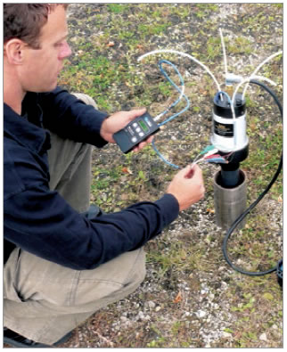 collecting a sample from a dedicated double valve pump (dvp) and taking pressure measurements with model 404 geokon vibrating wire readout