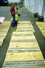Hydrogelogist Analyzing Cores Taken from Boreholr During Waterloo Multilevel Installation solinst waterloo sysyem flexibility waterloo multilevel system bedrock applications overburden applications groundwater groundwater monitoring multiple discrete zone monitoring waterloo systems image