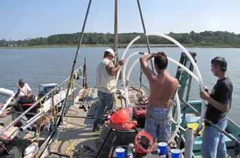 cmt systems were installed at the bottom of a bay to measure submarine groundwater discharge. eight 7-channel cmt systems were installed, with custom modifications to suit the open water application. watertight wellheads had to be custom built to allow for sampling from the surface of the bay using a peristaltic pump.